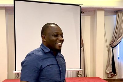 Michael Kamukulu leading an education workshop in Tanzania